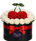 Decorative box with white flowers, red cherries, and a red bow, featuring 'Blessed & Booked' on a white background.