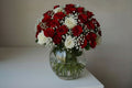 Bouquet of red and white roses in a Clear Vase with A Touch of Love'